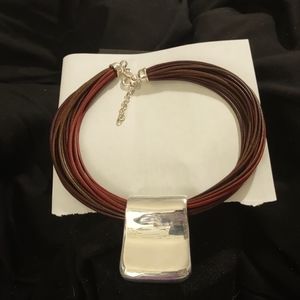 SALE WAS $42 NOW $28 2x3" STERLING SILVER AND 20 STRAND LEATHER PENDENT NECKLACE